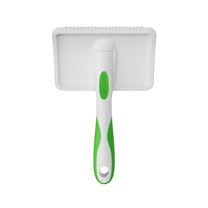 White pet grooming brush with green handle on a white background